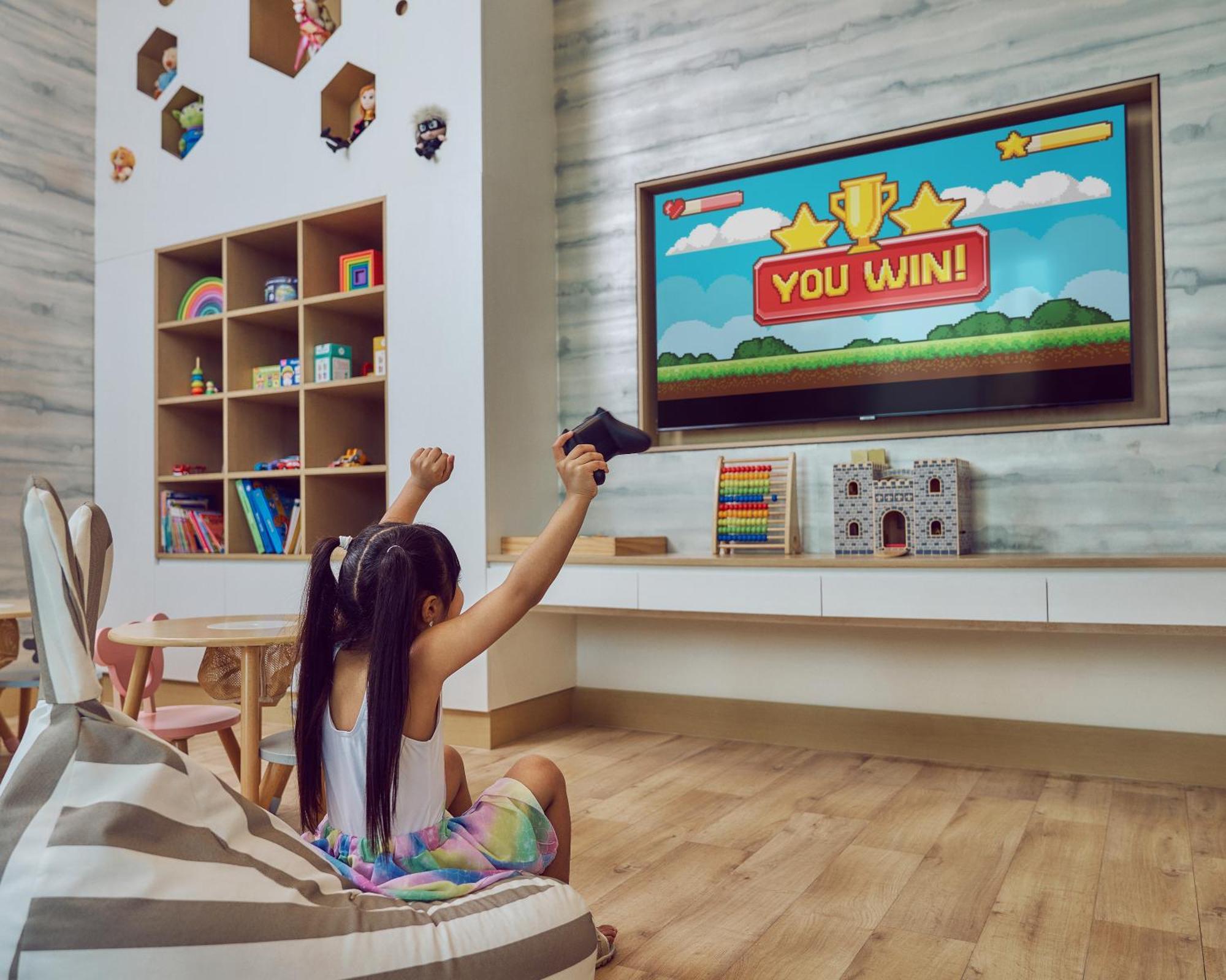 Address Beach Resort Bahrain Manama Exterior photo A child playing a game on a television